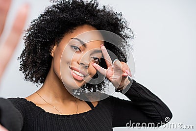 Close up self portrait of a beautiful african american woman taking a selfie. Stock Photo