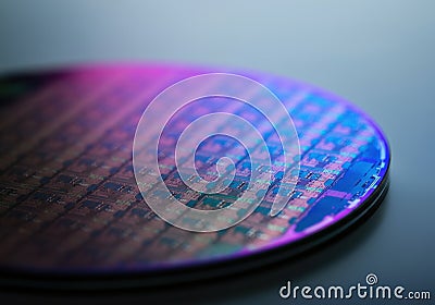 Close-up of a semiconductor wafer showcasing intricate microchip patterns Stock Photo