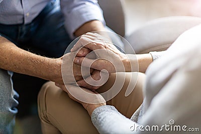 Senior couple holding hands Stock Photo