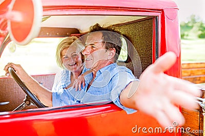 Close up of senior couple inside a pickup truck Stock Photo