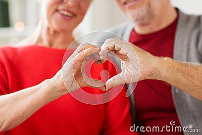 Close up of senior couple showing hand heart sign Stock Photo