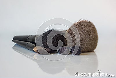 A close-up set of professional make-up brushes with a reflection Stock Photo