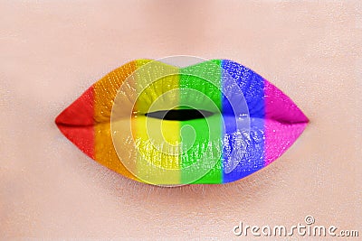 Close up of sexy caucasian woman perfect lips with rainbow lipstick. LGBT, lesbian love and pride concept Stock Photo
