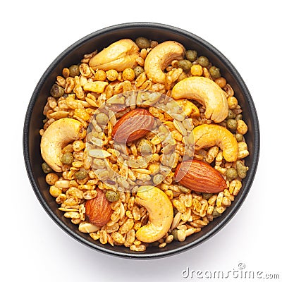 Close-Up of Shahi Mixture in a black ceramic bowl, made with peanut, cashew, almonds. Indian spicy snacks Namkeen. Stock Photo