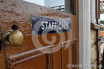 Close-up and shallow focus view of a Staff Room vintage railway sign. Editorial Stock Photo