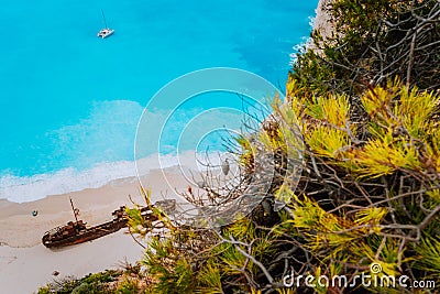 Close up of Shipwreck in Navagio beach. Azure turquoise sea water and paradise sandy beach. Famous tourist visiting Stock Photo