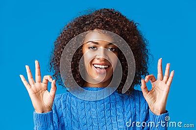 Close-up shot assured and assertive, confident young african american woman say everything under control, alright all Stock Photo