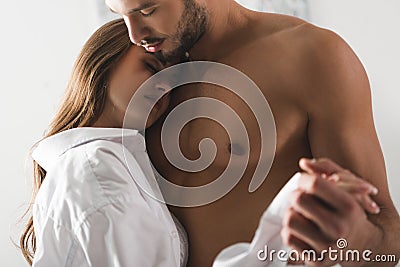 close-up shot of attractive young couple dancing at home Stock Photo