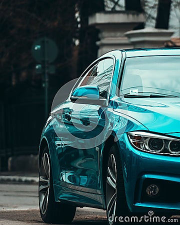 Close up shot of a Beautiful car painted in metallic blue parked in the streets of Bucharest Editorial Stock Photo