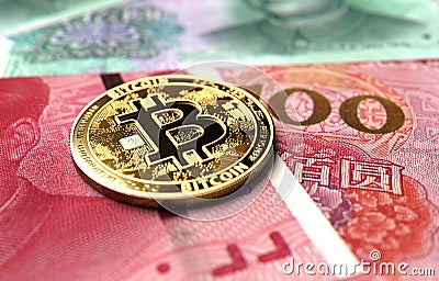 Close-up shot on Bitcoin coin laying on Chinese Yuan bills. Price of Bitcoin in China concept. 3D rendering Stock Photo