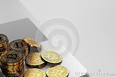 Close-up shot on Bitcoin piles laying on bright background. Stock Photo