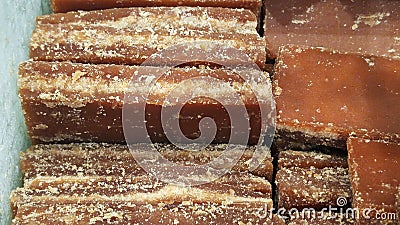 Close-up shot of cane candy. A pile of pieces of sugar are displayed for sale in the supermarket. Stock Photo