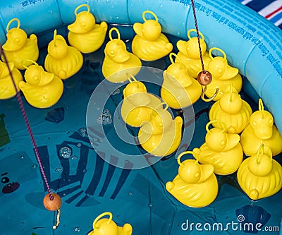 Close-up shot of children's 'hook a duck' game in a pool Stock Photo
