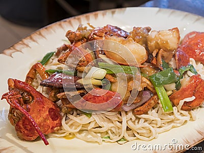 Close up shot of a Chinese style fried lobster and noodles Stock Photo