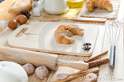 Close up shot of Croissant and bekery ingredients on wooden table Stock Photo