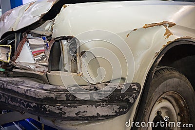 Close up shot of damaged car. Front damage Stock Photo