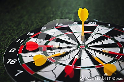 Close up shot of a dart board. Darts arrow Missing the target on a dart board during the game. Stock Photo