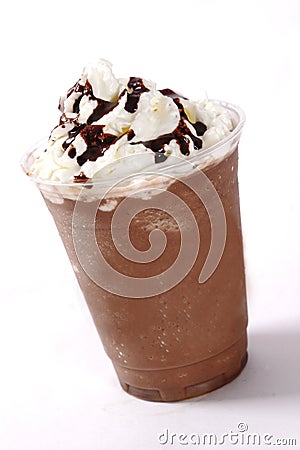 Close up shot of delicious creamy chocolate cold milkshake with whipped cream on top Stock Photo