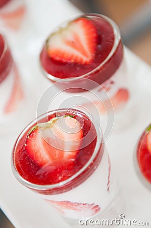 Close-up shot of dessert strawberry with whipping cream. Stock Photo