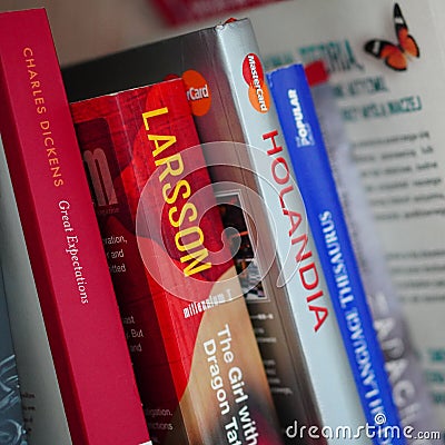 Close-up shot of different books on a shelf Editorial Stock Photo