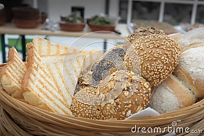 Close-up shot of different breads in a wicker basket. Stock Photo