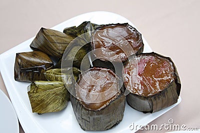 Close-up shot of the Glutinous Rice Cakes or nian gao in Mandarin on the white ceramic plate. Stock Photo