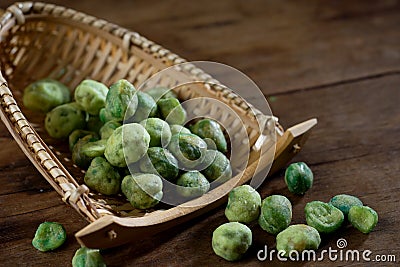 close up shot of green pea on wood background studio shot Stock Photo
