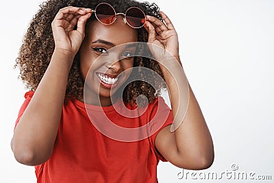 Close-up shot of happy satisfied and carefree african american woman forgetting about cold winter days sipping cocktail Stock Photo