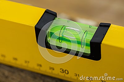 Shot of a level tool , yellow block level with bubble clipping path included. Stock Photo