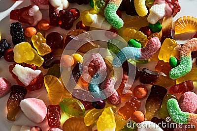 Close up shot of many tasty colorful gummies made from fruit juice, gelatin and sugar on white background Editorial Stock Photo