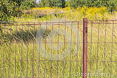 Close up shot of the metal rusted fence. Background Stock Photo
