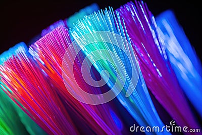 close-up shot of neon-colored toothbrush bristles, freshly moistened Stock Photo