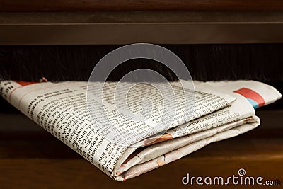 Close-up shot of newspaper coming in the mail box Stock Photo