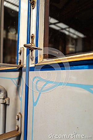 Close-up shot of an old train door handle Stock Photo