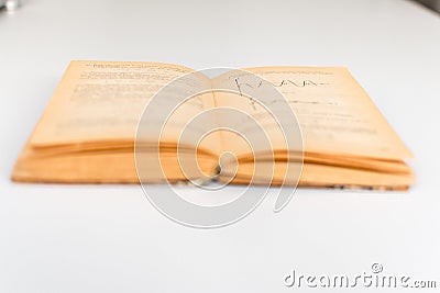 Close up shot of an open old science book containing equations and graphs from different fields: math, physics, chemistry. The Stock Photo