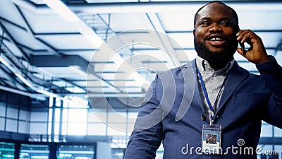 Close up shot of programmer in data center talking in phone call Stock Photo