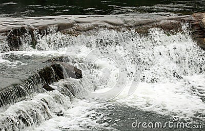 Close up shot of a rushing stream in forest creek Stock Photo