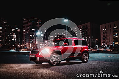 Close-up shot of a Skoda Yeti in a moody city at night Editorial Stock Photo