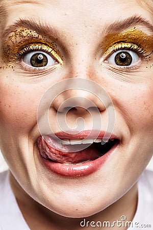 Close-up shot of smiling joyful young female face. Girl with an Stock Photo
