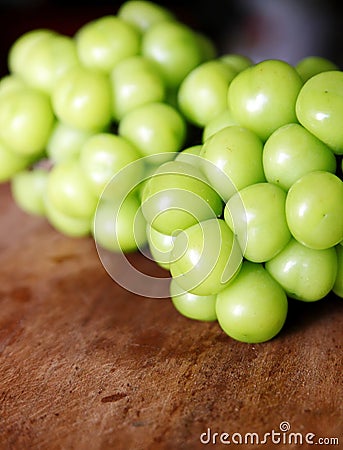 Close-up shot of some string of green grapes. Stock Photo