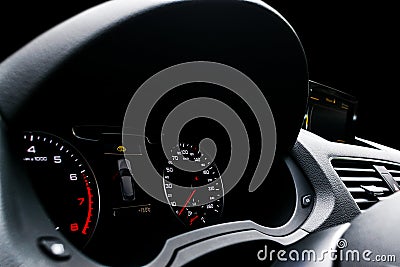 Close up shot of a speedometer in a car. Car dashboard. Dashboard details with indication lamps.Car instrument panel. Dashboard wi Stock Photo