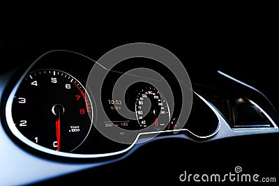 Close up shot of a speedometer in a car. Car dashboard. Dashboard details with indication lamps.Car instrument panel. Dashboard wi Stock Photo