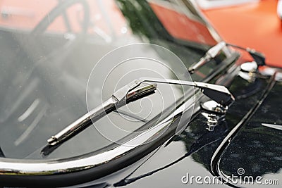 Vintage screen wiper on a car`s windshield Stock Photo