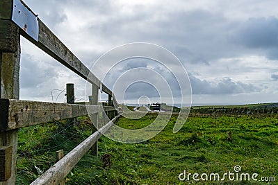 a wooden fence with a sign saying there are no horses Stock Photo