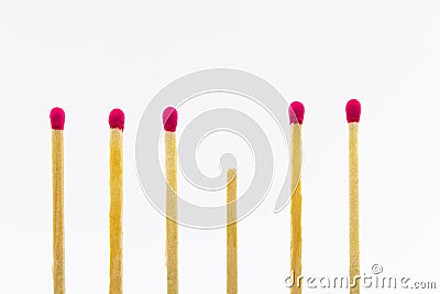 Close up shot of wooden matches separated from each other isolated on a white background Stock Photo