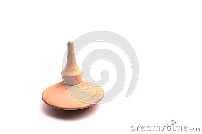 Close up shot of a wooden spinning top moving Stock Photo
