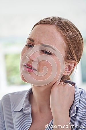 Close Up Shot Of Young Woman Suffering With Neckache Stock Photo