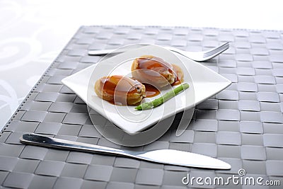 Close-up side view of Abalone being served in a restaurant Stock Photo