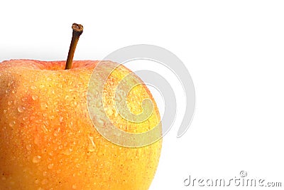 Yellow apple with red spots splattered with drops of water on white background Stock Photo
