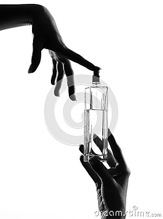 Close-up silhouette woman hands perfume Stock Photo